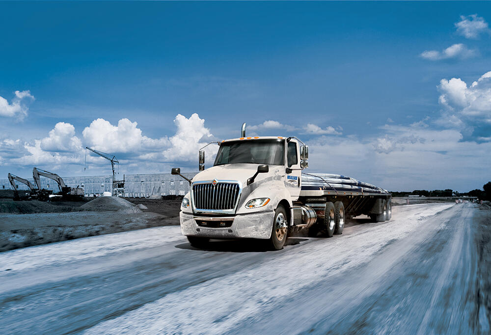 International LT Day Cab hauling Construction Materials